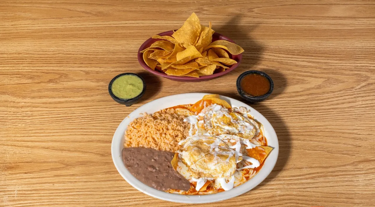 Chilaquiles with shrimp, salsa and crema